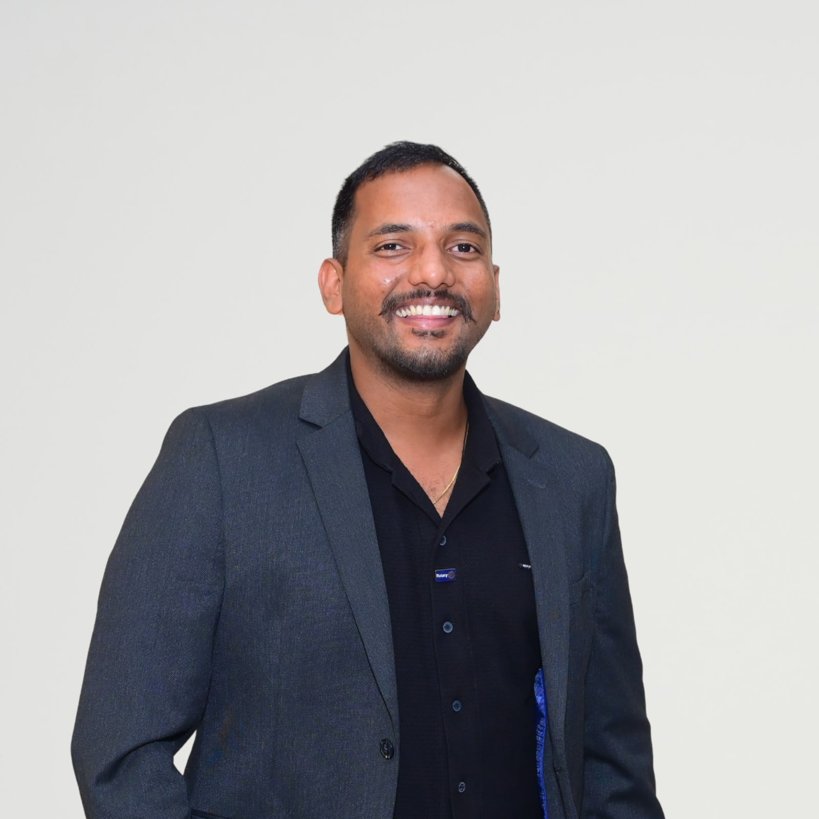 Portrait of Ajay Kanth Gopalam in a charcoal blazer